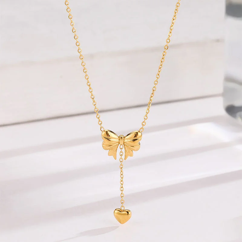 Necklaces and pendants with star-shaped designs for a whimsical, celestial touch-Wholesale Bow Heart Tassel Titanium Steel Necklace