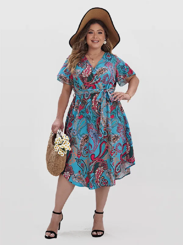 Plus size dresses featuring fringe accents feel bold -Paisley Print Wrap Belted Curve Hem Dress